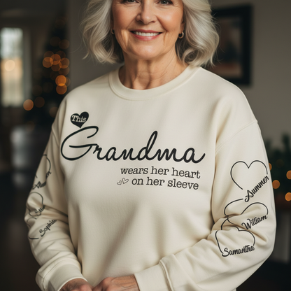 Grandma Wears Her Heart On Her Sleeve - Family Personalized Custom Unisex Sweatshirt With Design On Sleeve - Christmas Gift For Mom, Grandma
